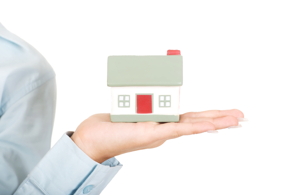 Businesswomans hand presenting a house model